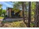 Exterior view of the back of the house with a brick retaining wall and a screened patio at 513 San Sebastian Ct, Davenport, FL 33837