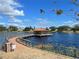 Community lake with a boardwalk, gazebo, and seating to enjoy the serene water views at 513 San Sebastian Ct, Davenport, FL 33837