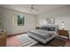 Cozy bedroom with a queen-size bed and ample light at 707 Carpenters Way # 45, Lakeland, FL 33809