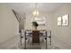 Bright dining room with table and chairs for six at 707 Carpenters Way # 45, Lakeland, FL 33809