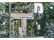 Aerial view of a residential community under construction surrounded by lush greenery at 977 Hawksnest Pt, Oviedo, FL 32765