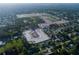 Wide aerial shot showcasing a residential development amid existing homes and wooded areas at 977 Hawksnest Pt, Oviedo, FL 32765