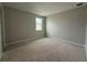 This room features neutral paint, a small window, and recessed lighting at 977 Hawksnest Pt, Oviedo, FL 32765
