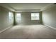The bedroom offers natural light with windows, recessed lighting, and ample space for a comfortable retreat at 977 Hawksnest Pt, Oviedo, FL 32765