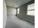 An empty bedroom with large windows offering ample light at 977 Hawksnest Pt, Oviedo, FL 32765