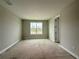 A bright bedroom with neutral paint, large window, and natural light at 977 Hawksnest Pt, Oviedo, FL 32765