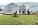 Charming two-story home with stone accents, manicured lawn, and freshly planted landscaping at 977 Hawksnest Pt, Oviedo, FL 32765