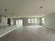 The living room flows into the kitchen, which features a large island and sliding door access at 977 Hawksnest Pt, Oviedo, FL 32765
