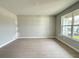 Bright living room with beautiful tile floors and large windows offering plenty of natural light at 977 Hawksnest Pt, Oviedo, FL 32765