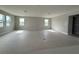 Spacious living room area featuring tile floors, recessed lighting, and bright natural light at 977 Hawksnest Pt, Oviedo, FL 32765