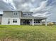 Expansive backyard view with covered patio and well-maintained lawn, ideal for outdoor living at 987 Hawksnest Pt, Oviedo, FL 32765