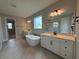 Spacious bathroom featuring a soaking tub, separate vanities, and a glass shower at 987 Hawksnest Pt, Oviedo, FL 32765