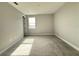 An airy bedroom with neutral gray walls and plush carpet flooring offering a serene and cozy atmosphere at 987 Hawksnest Pt, Oviedo, FL 32765