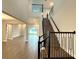Open-concept foyer with staircase, wood floors and railings at 987 Hawksnest Pt, Oviedo, FL 32765