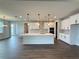 Bright, open kitchen featuring a large island, pendant lighting, and modern, stainless appliances at 987 Hawksnest Pt, Oviedo, FL 32765