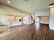 Expansive open-concept living space with wood-look floors and a seamless flow to the kitchen at 987 Hawksnest Pt, Oviedo, FL 32765