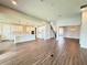 Expansive open-concept living space with wood-look floors and a seamless flow to the kitchen at 987 Hawksnest Pt, Oviedo, FL 32765