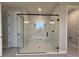 Modern walk-in shower featuring black trim glass and stylish tile work at 987 Hawksnest Pt, Oviedo, FL 32765