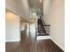 Open-concept home featuring an elegant staircase and views into the adjacent living areas at 987 Hawksnest Pt, Oviedo, FL 32765