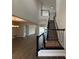Open-concept home featuring an elegant staircase and views into the adjacent living areas at 987 Hawksnest Pt, Oviedo, FL 32765