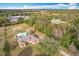 Aerial shot featuring the house, backyard pool, mature trees, and peaceful, private setting at 24217 Adair Ave, Sorrento, FL 32776