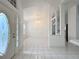 Inviting foyer with tile flooring, open layout, and natural light, creating a warm welcome at 24217 Adair Ave, Sorrento, FL 32776