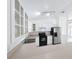 Bright kitchen with stainless steel appliances and white cabinets at 24217 Adair Ave, Sorrento, FL 32776