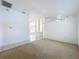 Large living room with carpet and view to adjacent kitchen, and dining area at 24217 Adair Ave, Sorrento, FL 32776