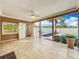 Covered patio showing the swimming pool and well-maintained backyard at 24217 Adair Ave, Sorrento, FL 32776