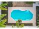 Backyard swimming pool with steps, rock feature, and a patio for entertaining at 24217 Adair Ave, Sorrento, FL 32776