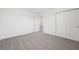A bedroom features neutral walls, plush carpet, and a closet, creating a comfortable and functional space at 2735 Virginia Pine Dr, Bartow, FL 33830