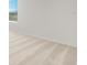 A bedroom with neutral carpet, white walls, and natural light from a window at 2735 Virginia Pine Dr, Bartow, FL 33830