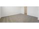 Empty bedroom with neutral carpeting and a doorway leading to another room at 2735 Virginia Pine Dr, Bartow, FL 33830