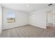 Bedroom with neutral carpet, white walls, natural light, and closet with sliding doors at 2735 Virginia Pine Dr, Bartow, FL 33830