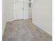 Clean and modern entryway with stylish gray tile flooring and white walls at 2735 Virginia Pine Dr, Bartow, FL 33830