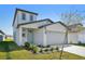Charming two-story home featuring a well-manicured lawn and a neatly attached two-car garage at 2735 Virginia Pine Dr, Bartow, FL 33830