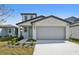 Charming two-story home featuring a two-car garage and manicured landscaping at 2735 Virginia Pine Dr, Bartow, FL 33830