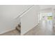 Bright hallway with neutral tile flooring, leading to a naturally lit open space at 2735 Virginia Pine Dr, Bartow, FL 33830
