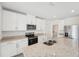 Modern kitchen featuring stainless appliances, granite counters, and an island with seating at 2735 Virginia Pine Dr, Bartow, FL 33830