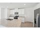 Close up of the kitchen area featuring stainless steel appliances and a kitchen island with a double sink at 2735 Virginia Pine Dr, Bartow, FL 33830