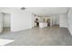 Open-concept living area with tiled floors connecting the kitchen and other living spaces at 2735 Virginia Pine Dr, Bartow, FL 33830