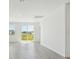 Open living space with gray tile flooring, bright walls, and plenty of natural light at 2735 Virginia Pine Dr, Bartow, FL 33830