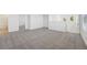 Upstairs loft featuring neutral carpet, white walls, and natural light from a window at 2735 Virginia Pine Dr, Bartow, FL 33830