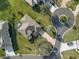 Aerial view showcases the house and well-manicured lot in a cul-de-sac at 27601 Country Stone Ct, Leesburg, FL 34748