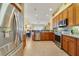 Spacious kitchen with stainless steel appliances and decorative backsplash at 27601 Country Stone Ct, Leesburg, FL 34748