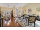 Open-concept living room featuring wood floors and neutral colors at 27601 Country Stone Ct, Leesburg, FL 34748