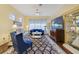 Comfortable living room with ceiling fan, and cabinet for storage at 27601 Country Stone Ct, Leesburg, FL 34748