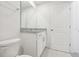 Clean bathroom with granite countertop, white cabinets, and updated fixtures at 3314 Thicket St, Tavares, FL 32778