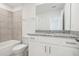 Bathroom with granite countertop, white cabinets, and bathtub at 3314 Thicket St, Tavares, FL 32778