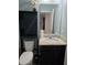 Bathroom with granite vanity top, modern toilet, and a view into an open bedroom at 3811 Island Green Way, Orlando, FL 32824